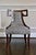 A pair of Greek Key Side Chairs by Thomas Pheasant for Baker Furniture. With a beautiful mahogany veneer on the legs....
