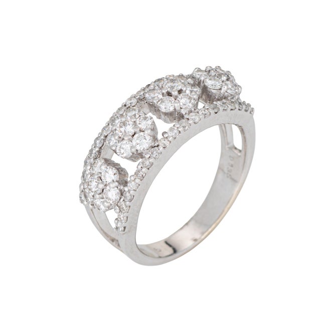 Stylish contemporary diamond cluster ring crafted in 14 karat white gold. Diamonds total an estimated 1.35 carats...