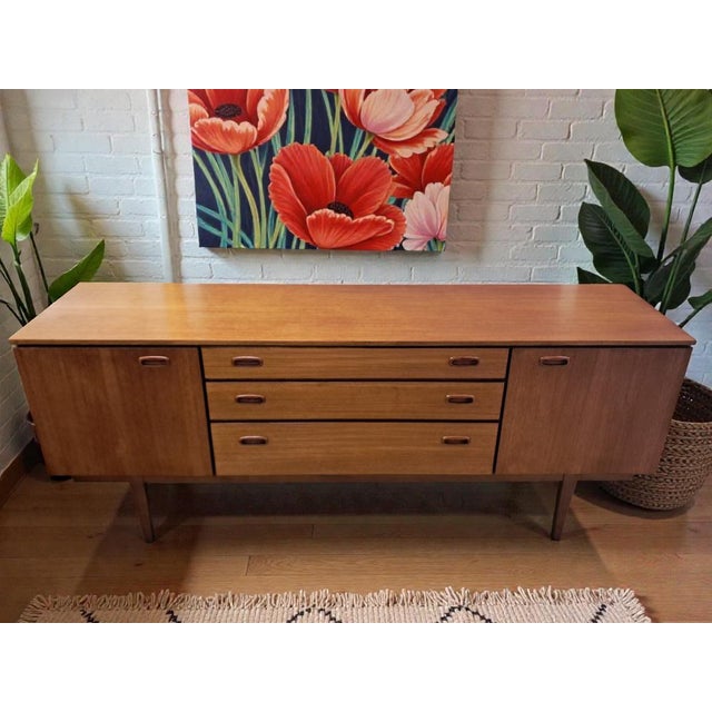 A beautifully proportioned mid century sideboard by nathan furniture, dating from the 1960s and showcasing a superb,...