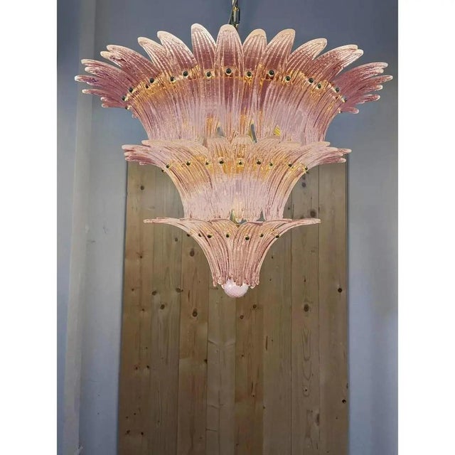 Lot of 2 mid-century modern pink “palmette” murano glass chandeliers a pair chandelier made with pink “palmette” elements...