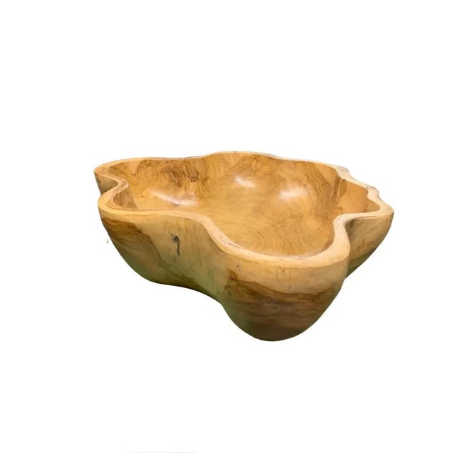 This teak live edge bowl is a unique piece showcasing the natural beauty of teak wood. Crafted by skilled artisans, its...
