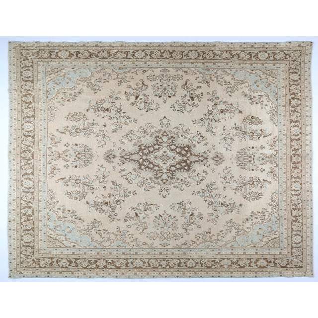 This vintage hand-knotted Nain rug brings timeless Persian elegance into any living space. Its intricate central medallion...