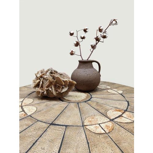 This round vintage stone coffee table is a real eye-catcher. Country of origin: Denmark. The top is constructed of stone...