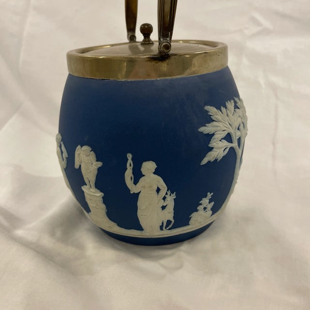 Antique English Wedgewood, cobalt blue Jasperware biscuit barrel with sacrifice design Silverplated Lid and Handle. Marked...