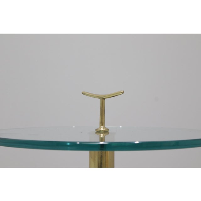 Brass coffee tables with glass tops This piece is attributed to the mentioned designer/maker. It has no attribution mark...