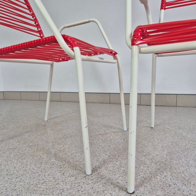 Mid-Century Modern Red Spaghetti Armchair from Mauser, 1970s, in Very Good conditions. Designed 1970 to 1979 This piece...