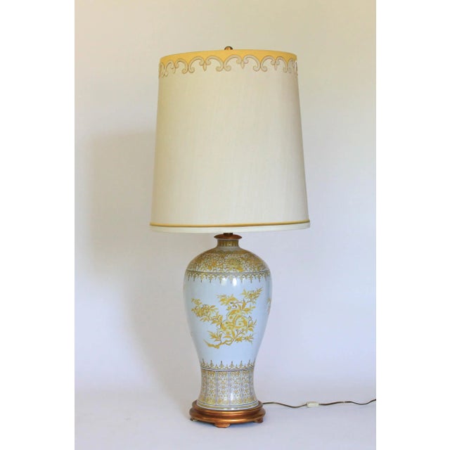 Beautiful mid-century table lamp by Marbro Lamp Company. The porcelain white and yellow lamp features pomegranate...