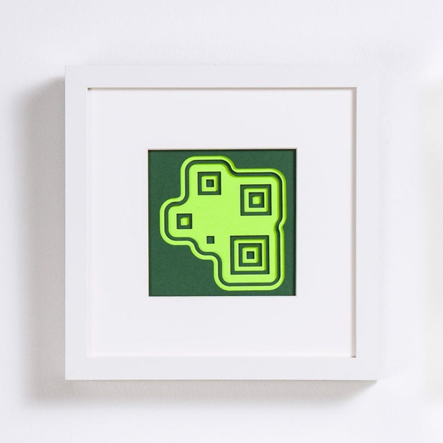 Neon Ivy features a striking arrangement of hand-cut, suspended, layered colored paper, creating a dynamic interplay of...