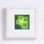 Neon Ivy features a striking arrangement of hand-cut, suspended, layered colored paper, creating a dynamic interplay of...
