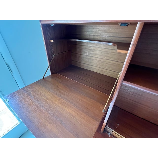 Teak Danish hutch. In great vintage. Comes with shelves and brass shelf pegs. No major flaws. No structural issues. Each...