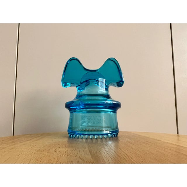 Vintage Glass Insulator In beautiful Aqua Blue With Great Mickey Mouse style top. Wide saddle groove piece with Sharp drip...