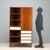 Vintage Italian-made piece of furniture made of wood with mahogany veneer, featuring open compartments, a hinged door, and...