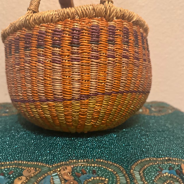 An exceptional example of traditional West African craftsmanship, this authentic Bolgatanga (Bolga) market basket features...