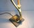 This table lamp from the cobra series impresses with its italian modern elegance. the lamp base as a stylized cobra is...