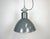 This industrial factory pendant lamp was made by Polam Wilkasy in Poland during the 1960s. It features a dark grey...