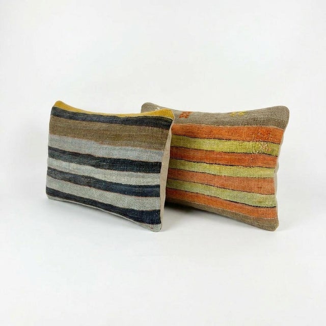 This beautiful 16'' x 24'' pillow cover set was made from authentic Turkish rug pieces. Bright colors of wool adorn the...