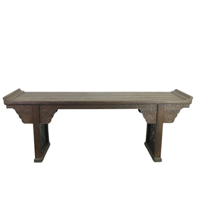 The wide paneled spandrels decorated with beautifully hand carved flowers and curly tendrils under the top of the table...