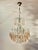 This refined Italian chandelier from the 1950s is crafted in a finely detailed waterfall-style beaded structure and...