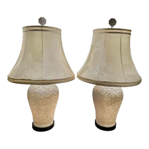 Pair of 1970s Chapman White Floral and Bird Relief Chinoiserie Lamps With White Silk Patterned Shades