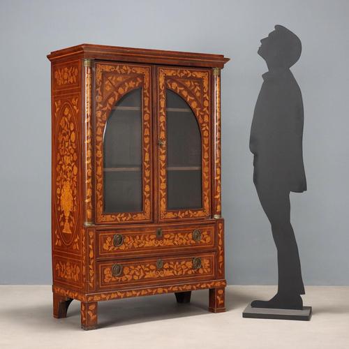 Dutch mahogany bookcase. All-over maple floral inlays and purfling. The front features two drawers surmounted by a pair of...