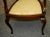 Antique (1900s) Arm Chair has an Edwardian Style. The Chair is Made of Wood. Mahogany. Inlaid Back Panel. The Seat has...