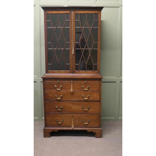 A Mahogany Bachelors Secretaire Bookcase The top part of this piece is an Astral glazed shelved bookcase, and beneath...