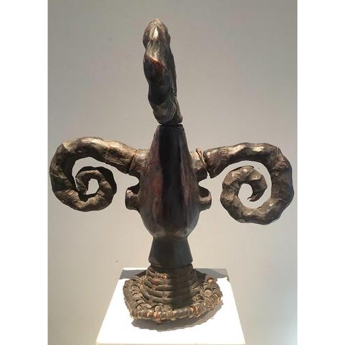 Nigeria Ekoi Mask Former French private collection This spectacular helmet mask, carefully covered in leather and...