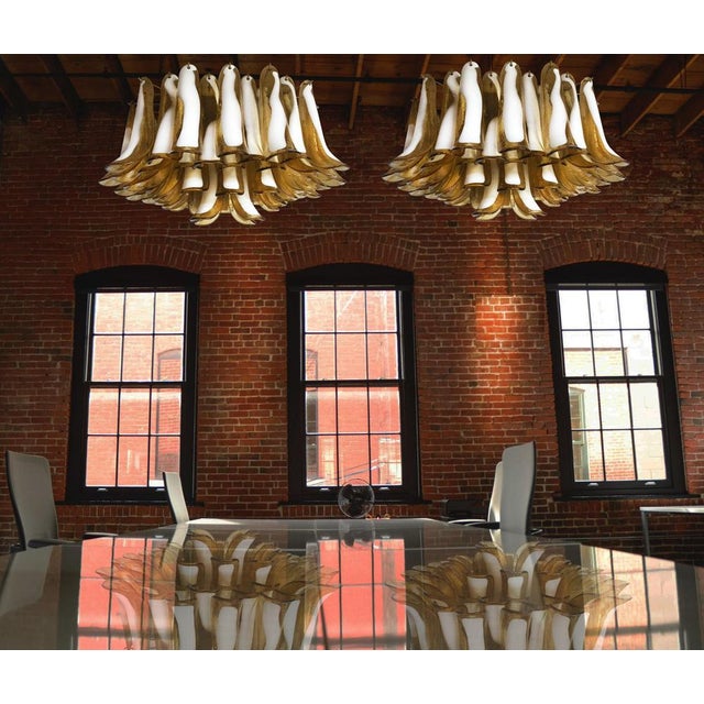 Spectacular ceiling lamp with 64 amber and lattimo Murano glass. Elegant lighting object. Period: late 20th century...