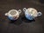 This vintage TE-OH China Nippon creamer and sugar bowl set features hand-painted pink floral designs with green foliage...