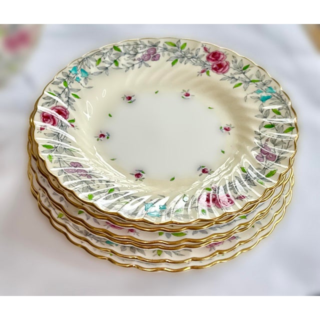Seven (7) Fine Bone China Dessert Plates by Minton. Printemps pattern with Pink, Blue, and Purple Flowers. Scalloped trim....