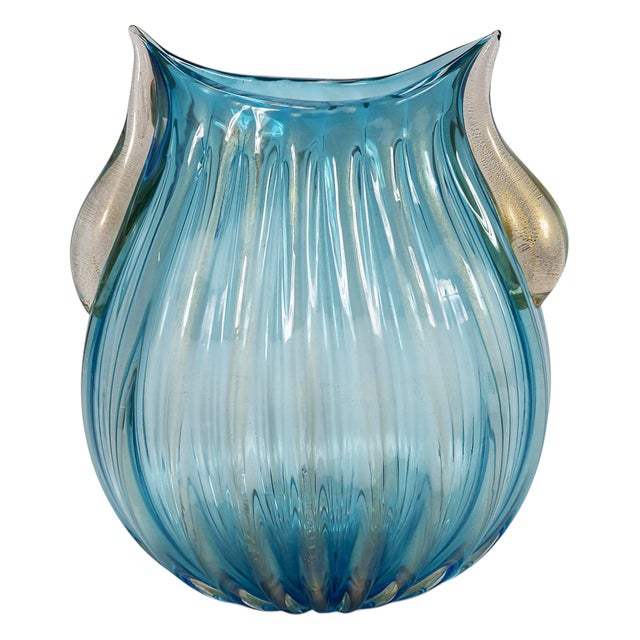 Large size vintage Italian handmade vase created in aquamarin blue color Murano glass with gold dust inside. The glass is...