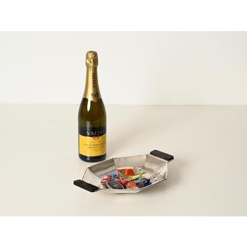 Stunning and unique art deco geometric centerpiece or vide-poche in silver-plated alpacca with ebonized wood handles. This...