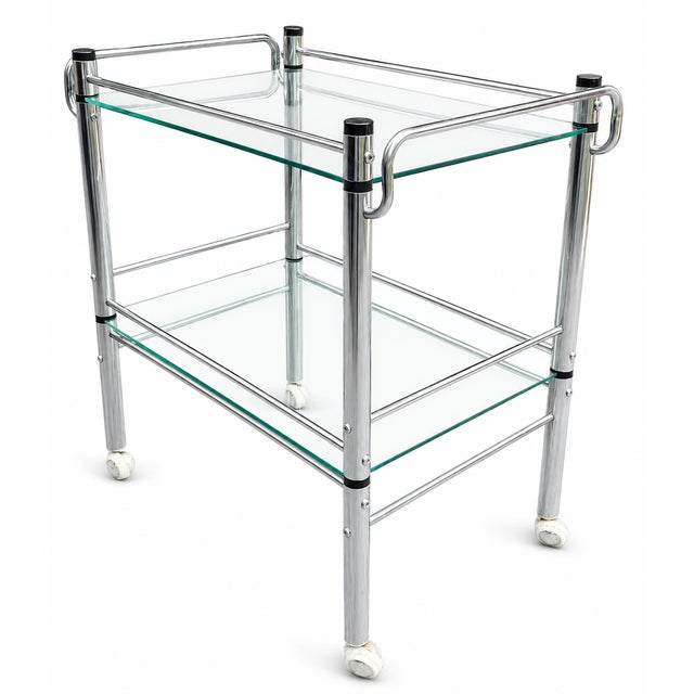 This 1980s modernist chrome tubular serving cart or bar trolley has a gallery-like presence, combining chrome and glass,...