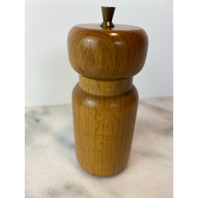 Vintage Danish modern salt or pepper grinder crafted in white oak with warm brass hardware details. This sculptural...