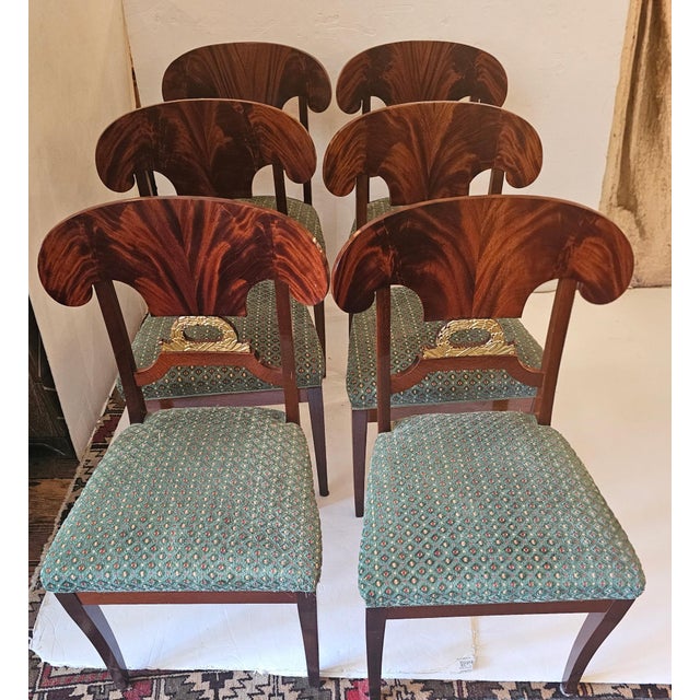 Gorgeous set of Biedermeier style or Karl Johan style side dining chairs having striking flared flame mahogany splat backs...