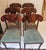 Gorgeous set of Biedermeier style or Karl Johan style side dining chairs having striking flared flame mahogany splat backs...