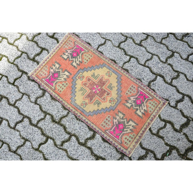 This is a vintage Turkish Oushak rug from the 1960s. The piece was hand-knotted.