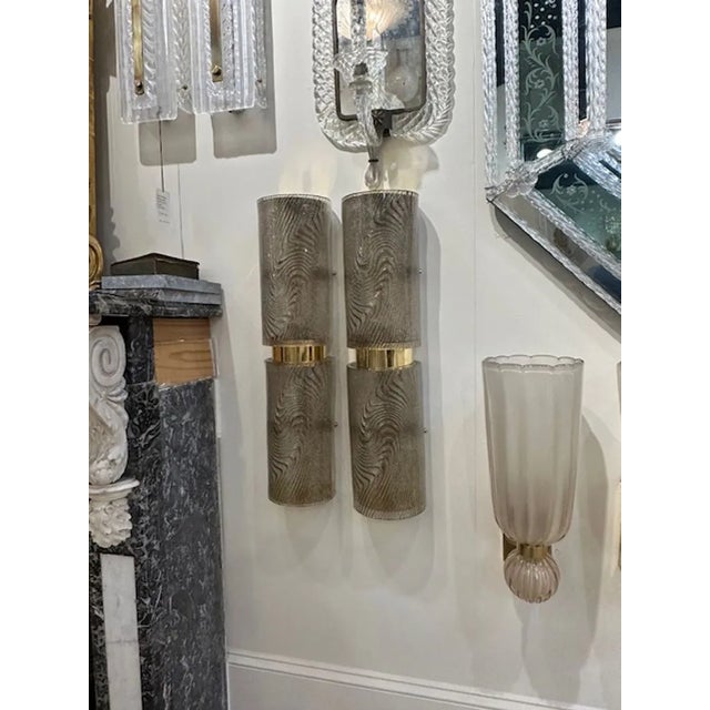 Beautiful pair of modern brown and gold Zebra patterned Murano glass sconces with brass. So much depth and color to this...