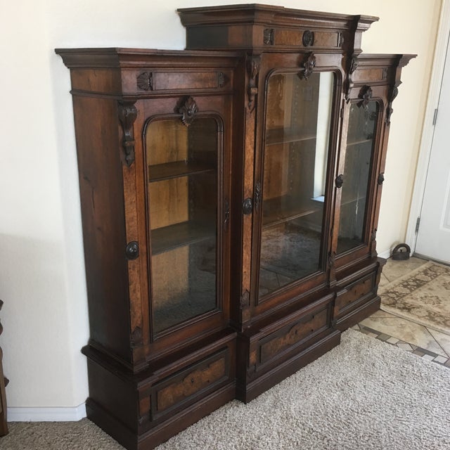 Antique Victorian bookcase with 3 adjustable shelves in each cabinet. There are 3 cabinet glass doors. 3 drawers under...