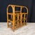Antique burnt bamboo magazine with gracefully bent canes, arched handles, geometric bentwood detailing and a rich natural...