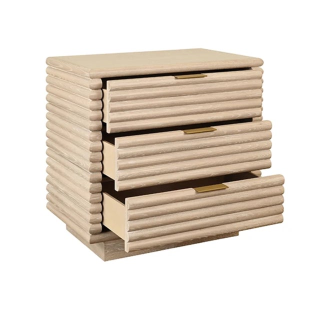 New special order item. Not vintage. Elegant three-drawer side table crafted from light cerused oak with striking...