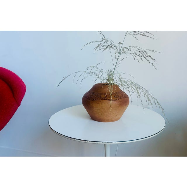 Jennifer Lee hand-built pottery vessels. ceramics and tapestry-making. Her practice is an exploratory one; Lee allows her...