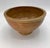 A beautifully thrown vintage stoneware bowl with a substantial rounded rim, high ring foot, and pronounced horizontal...