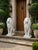 An impressive pair of large seated lion sculptures, designed as substantial architectural ornaments for entrances,...