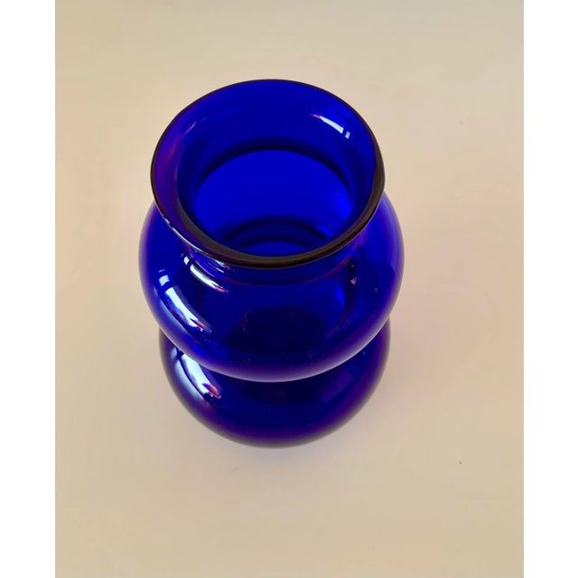 Purchased in Europe in the early 70s this vase has an amazing shade of blue. In addition its sinuous shape is very...