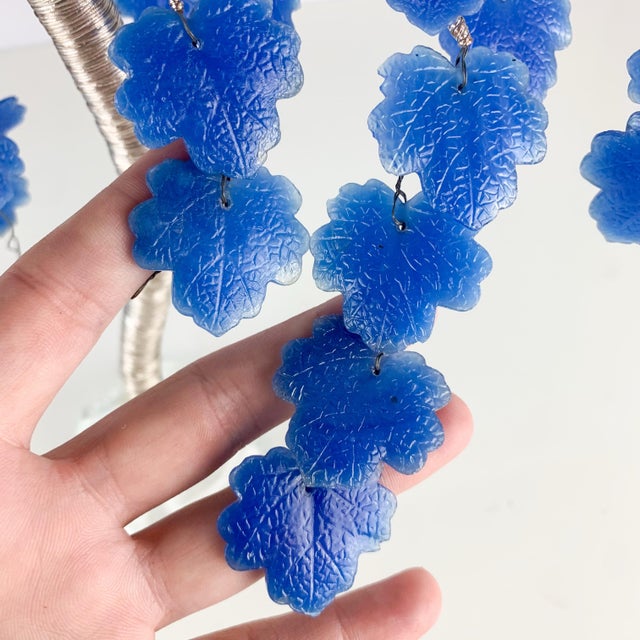 Beautiful vintage glass and wire tree with glass clear vase, silver wire and blue glass leaves. Love the details and size....