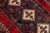 Beautiful vintage Persian Shiraz hand-knotted wool rug with a red field. This piece has a beige frame and multicolor...