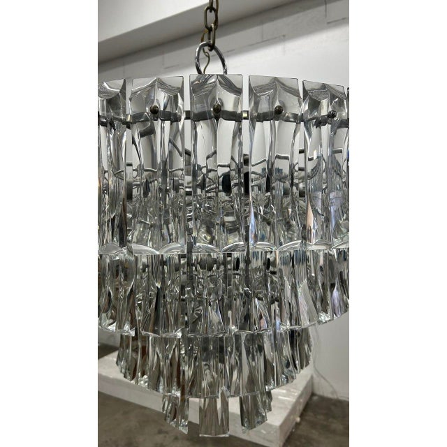 Chandelier from the 1960s and 1970s. Steel body, structured on three levels, with 14 lights with large sockets. The...