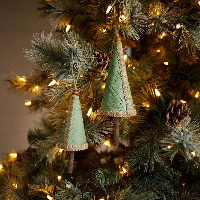 Bring a natural, rustic charm to your holiday decor with these Woven Bamboo Pine Tree Ornaments. Designed in festive green...