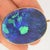 This exquisite pendant showcases two stunning double-cabochon Australian Black Opals, totaling approximately 35 carats....